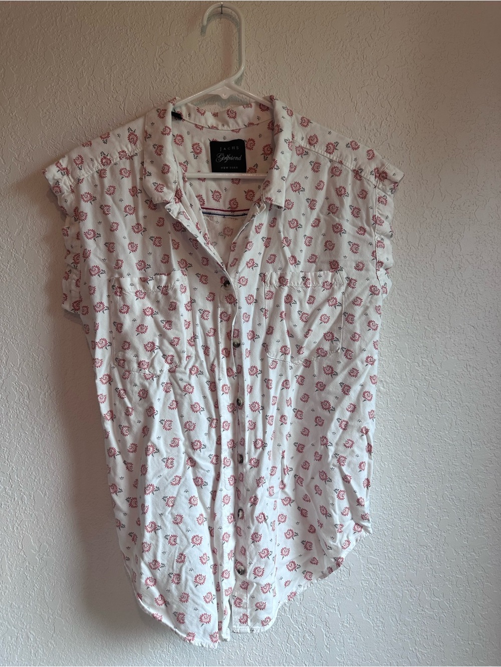 White Sleeveless Button-Down Shirt with Pink Print